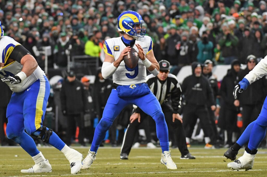 Jan 19, 2025; Philadelphia, Pennsylvania, USA; Los Angeles Rams quarterback Matthew Stafford (9) looks for a receiver against the Philadelphia Eagles in a 2025 NFC divisional round game at Lincoln Financial Field. Mandatory Credit: Eric Hartline-Imagn Images